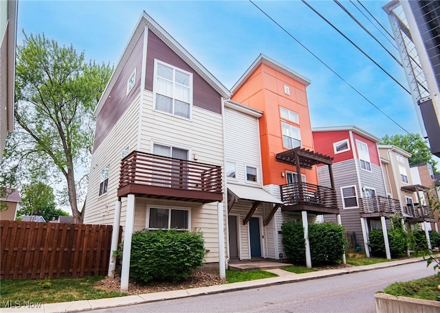 view of front of house featuring a balcony