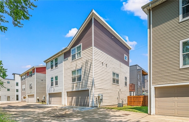 exterior space featuring a garage and central air condition unit