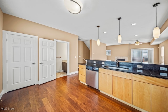 kitchen with sink, pendant lighting, stainless steel dishwasher, dark hardwood / wood-style floors, and light brown cabinetry