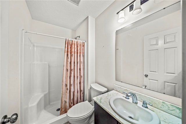 bathroom featuring vanity, toilet, a textured ceiling, and a shower with curtain