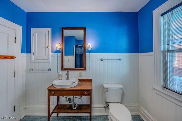 bathroom with sink, tile patterned floors, and toilet