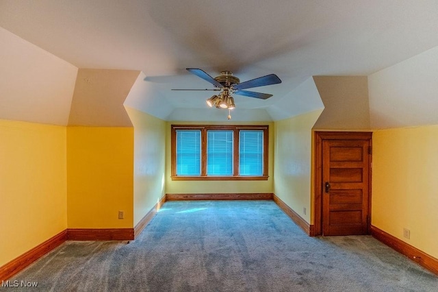 additional living space featuring ceiling fan, carpet, and lofted ceiling