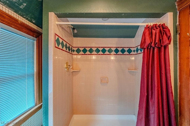 bathroom with a shower with shower curtain