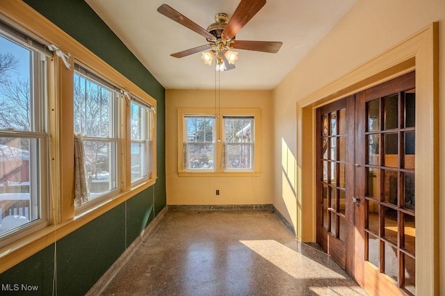 sunroom / solarium with ceiling fan