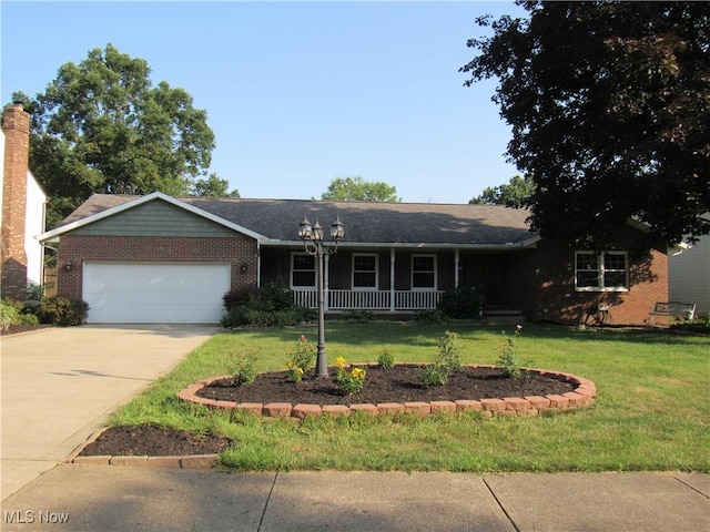 single story home featuring a garage and a front yard