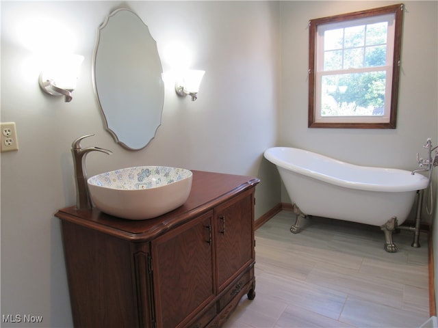 bathroom featuring vanity and a bathtub