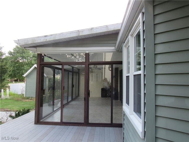 deck with a sunroom