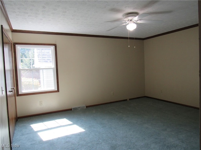 empty room with ceiling fan, ornamental molding, a textured ceiling, and carpet flooring