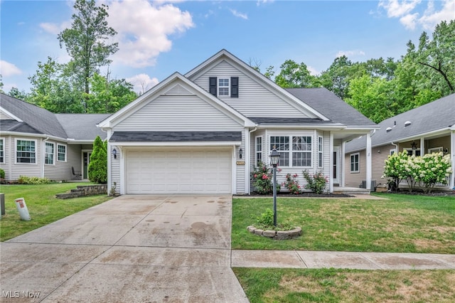 view of front of property featuring a garage and a front yard