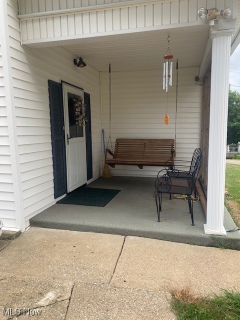 view of patio / terrace with a carport