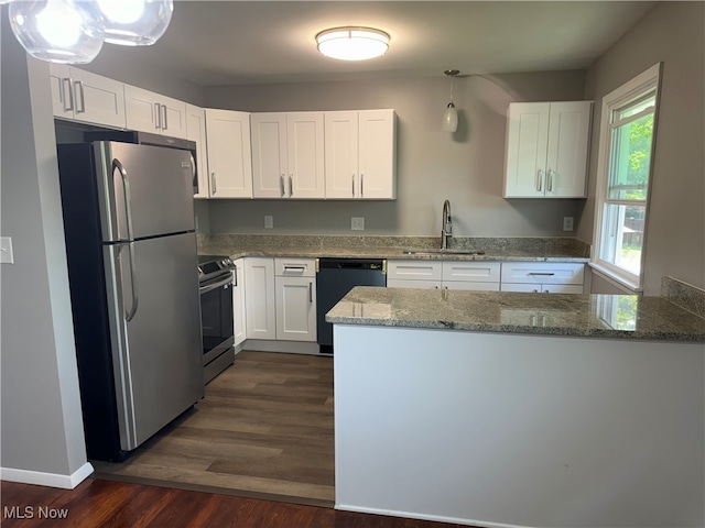 kitchen featuring stone counters, dark hardwood / wood-style flooring, white cabinetry, and stainless steel appliances