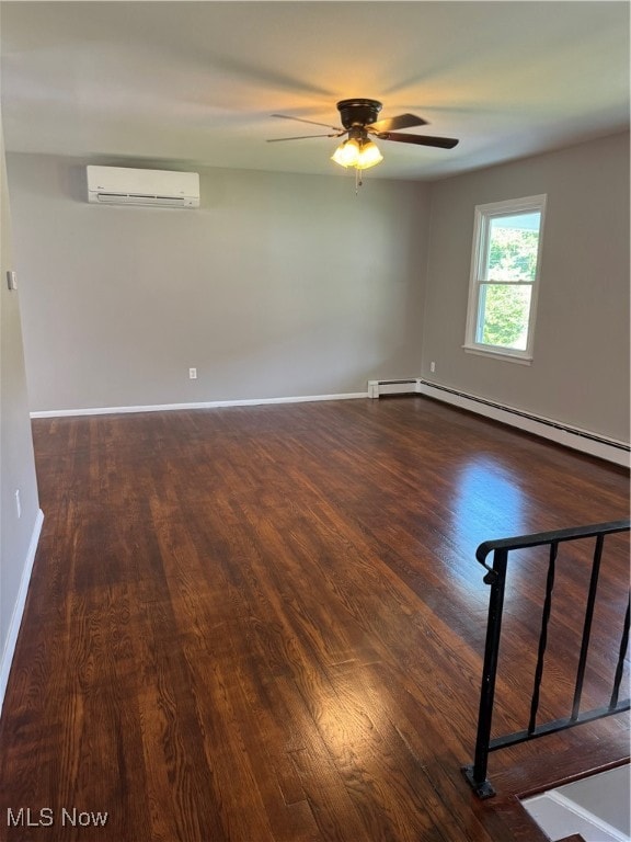 spare room with dark hardwood / wood-style floors, a baseboard heating unit, an AC wall unit, and ceiling fan