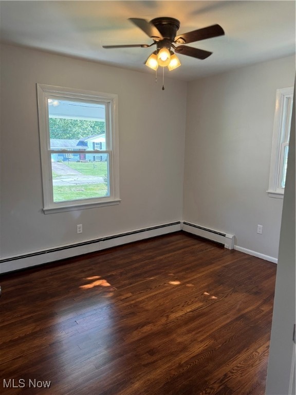 empty room with dark hardwood / wood-style floors and ceiling fan