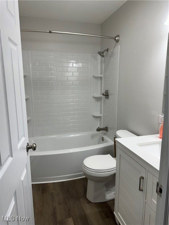 full bathroom featuring shower / bathtub combination, vanity, toilet, and hardwood / wood-style floors