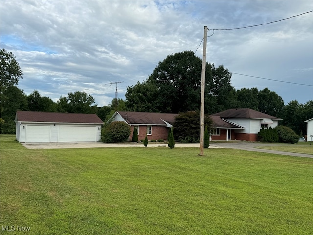 single story home featuring a garage and a front yard