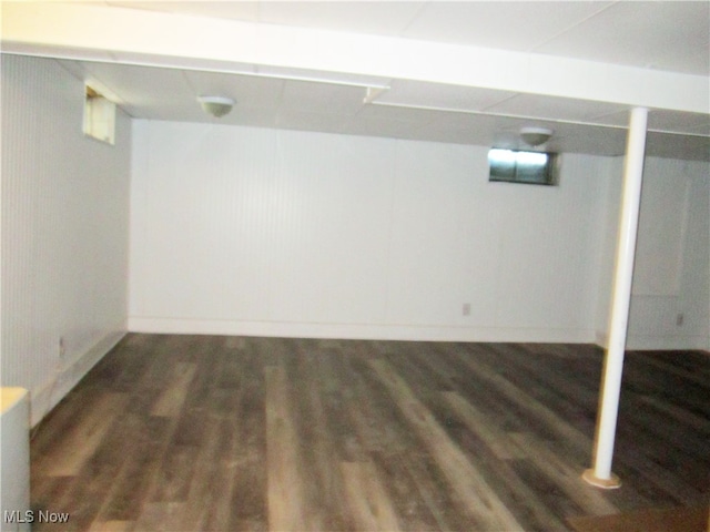 basement featuring dark hardwood / wood-style floors