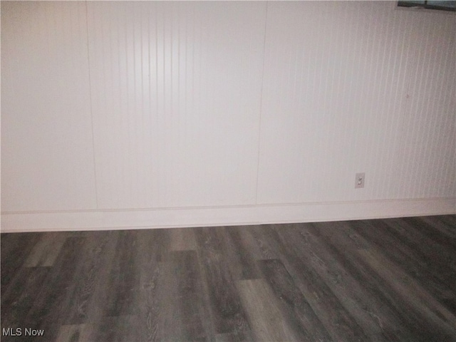 unfurnished room with dark hardwood / wood-style floors