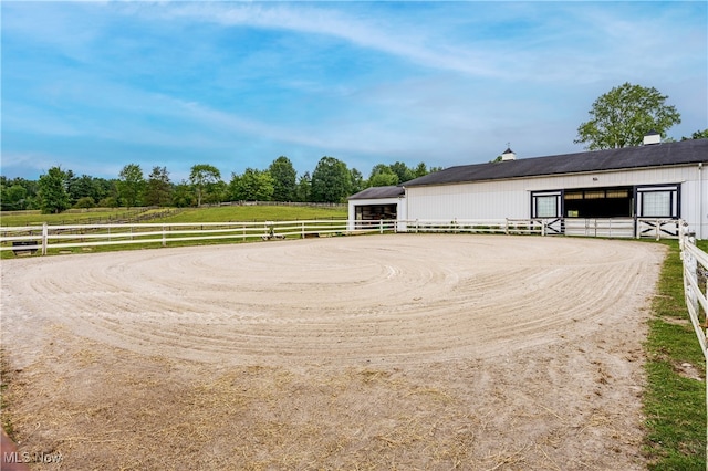 exterior space with an outbuilding and a rural view