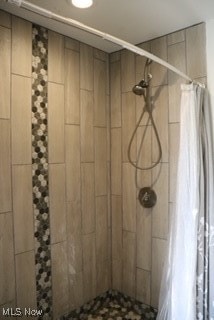 bathroom featuring curtained shower