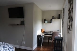 bedroom featuring dark hardwood / wood-style flooring