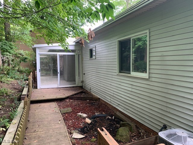 view of home's exterior with a wooden deck