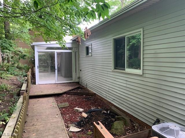 view of side of home with a sunroom