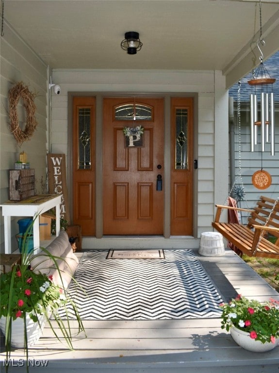 property entrance with covered porch