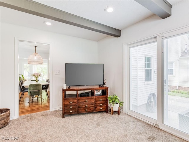 carpeted living area featuring beamed ceiling and recessed lighting