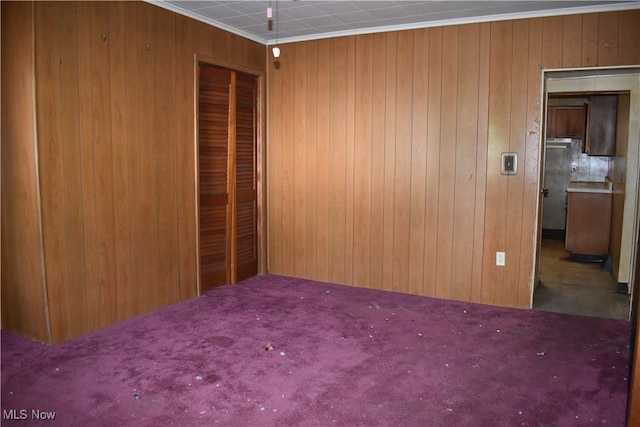 carpeted empty room with ornamental molding