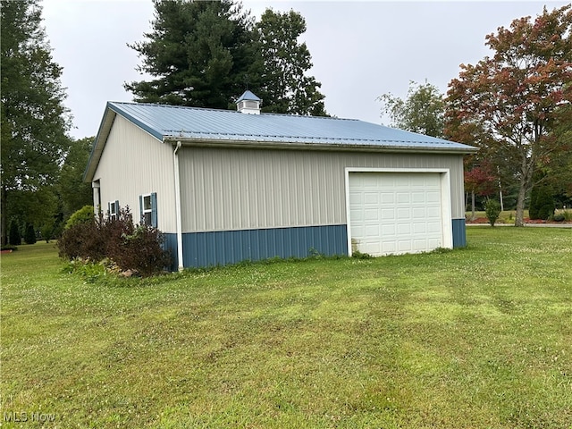 garage with a lawn