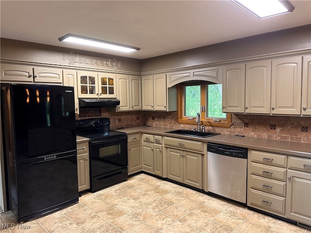 kitchen with tasteful backsplash, black appliances, sink, light tile patterned flooring, and ornamental molding