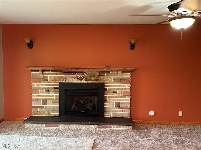 details featuring carpet, a brick fireplace, and ceiling fan