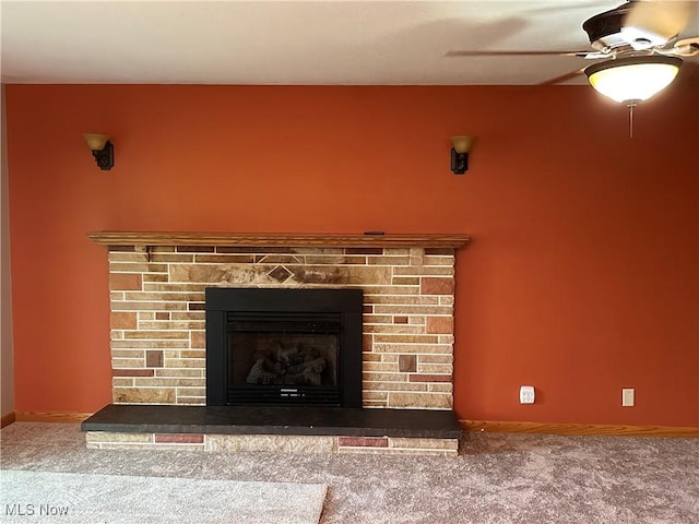 details featuring a fireplace, carpet floors, and ceiling fan