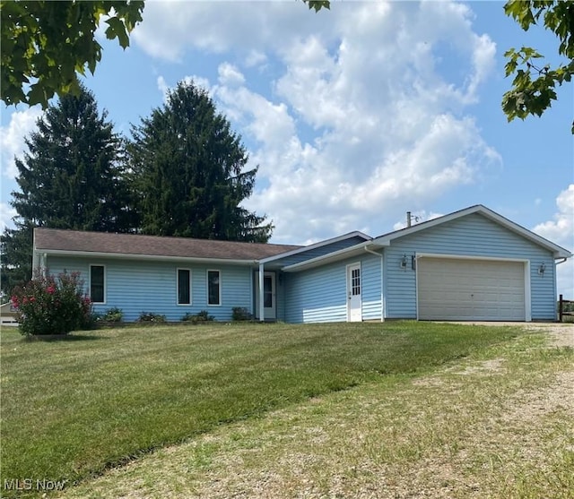 single story home with an attached garage, driveway, and a front lawn