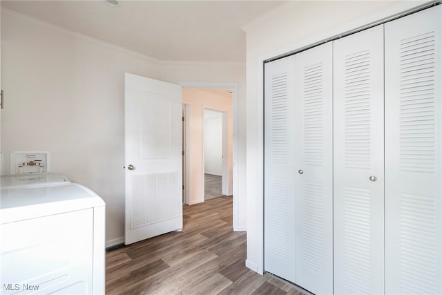 washroom with washer / clothes dryer, hardwood / wood-style flooring, and ornamental molding