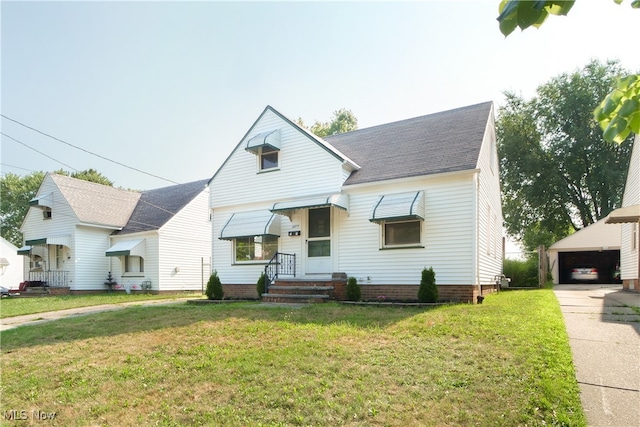 view of front of property featuring a garage and a front lawn