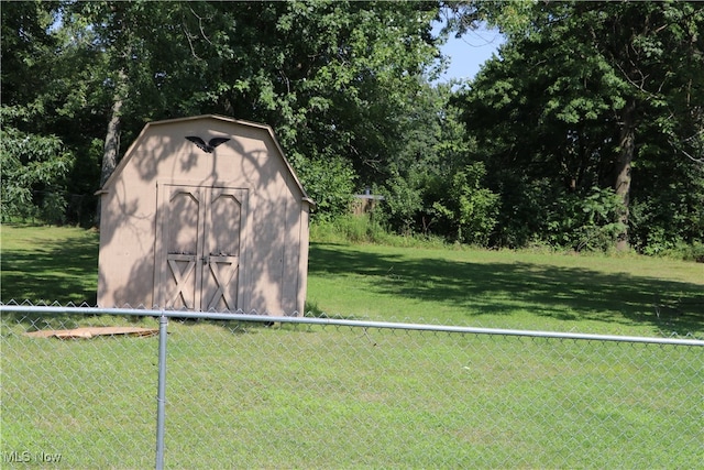 view of outdoor structure with a lawn