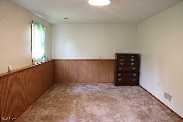 empty room featuring light carpet