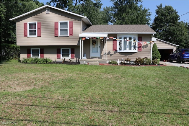 split level home featuring a front lawn