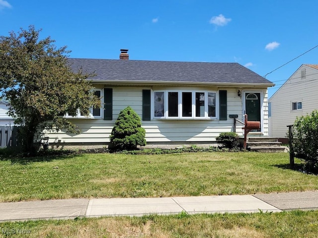 view of front of home with a front yard
