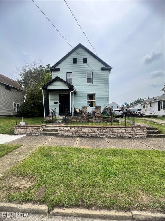 front of property featuring a front lawn