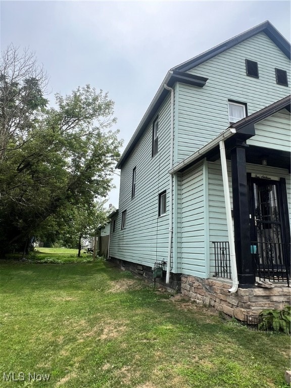 view of property exterior featuring a yard