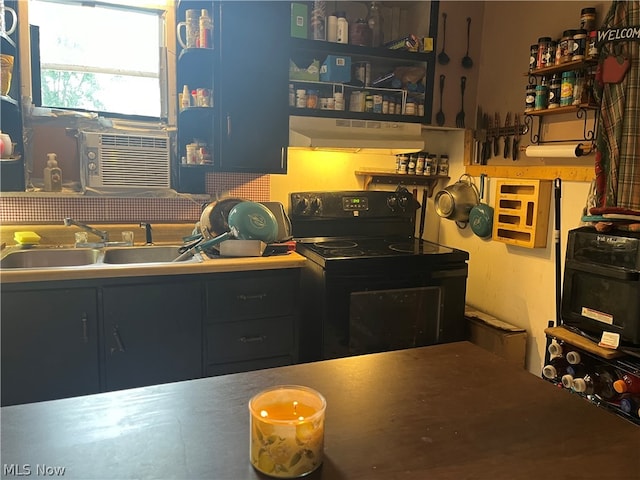 kitchen featuring electric range, cooling unit, sink, and range hood