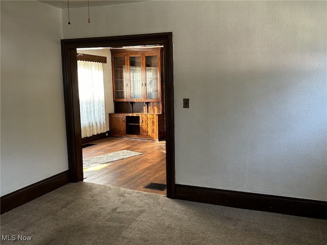 empty room featuring hardwood / wood-style floors