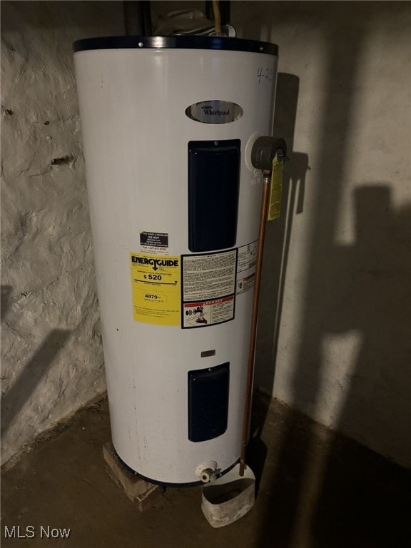 utility room with electric water heater