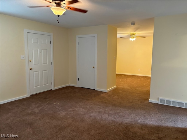 unfurnished room featuring ceiling fan and carpet floors