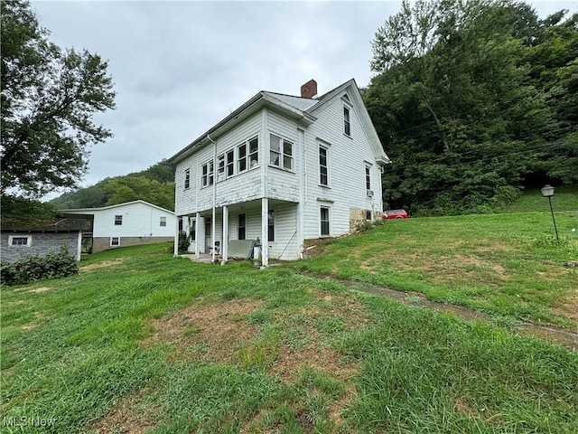 view of property exterior featuring a yard