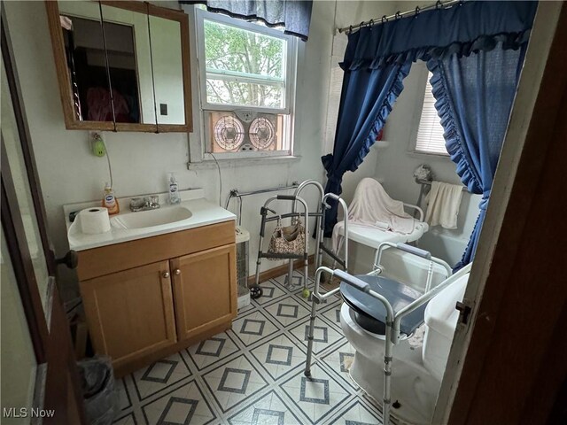 618 Market St, Clarington, OH 43915 - bathroom with vanity, tile patterned flooring, and toilet