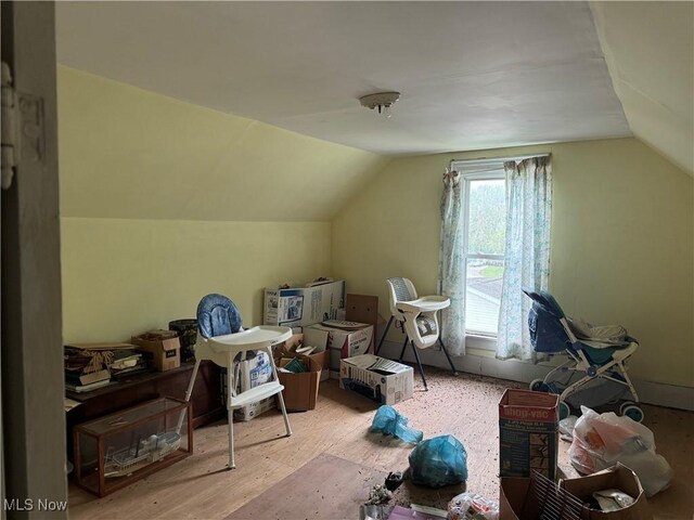 618 Market St, Clarington, OH 43915 - bonus room featuring vaulted ceiling and wood finished floors