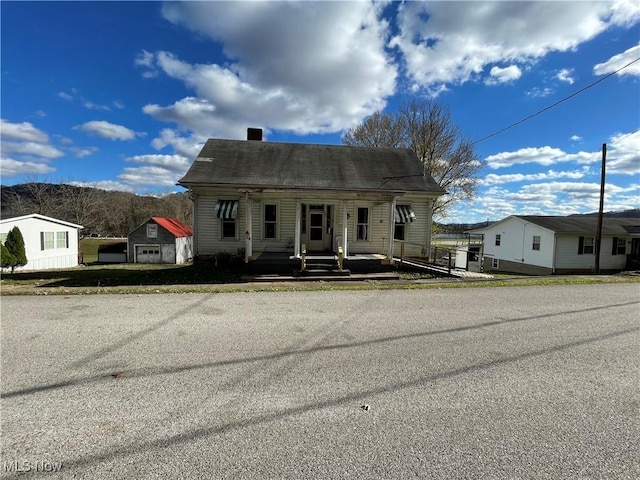 618 Market St, Clarington, OH 43915 - view of front of property with covered porch and a shingled roof